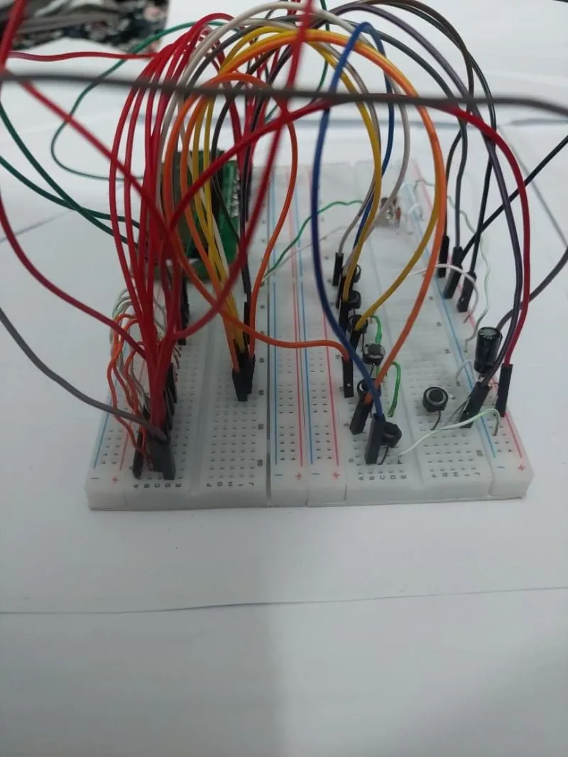 Close view of push buttons and wiring on the voting-machine breadboard.